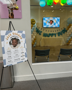 First birthday milestone sign outside of private party room