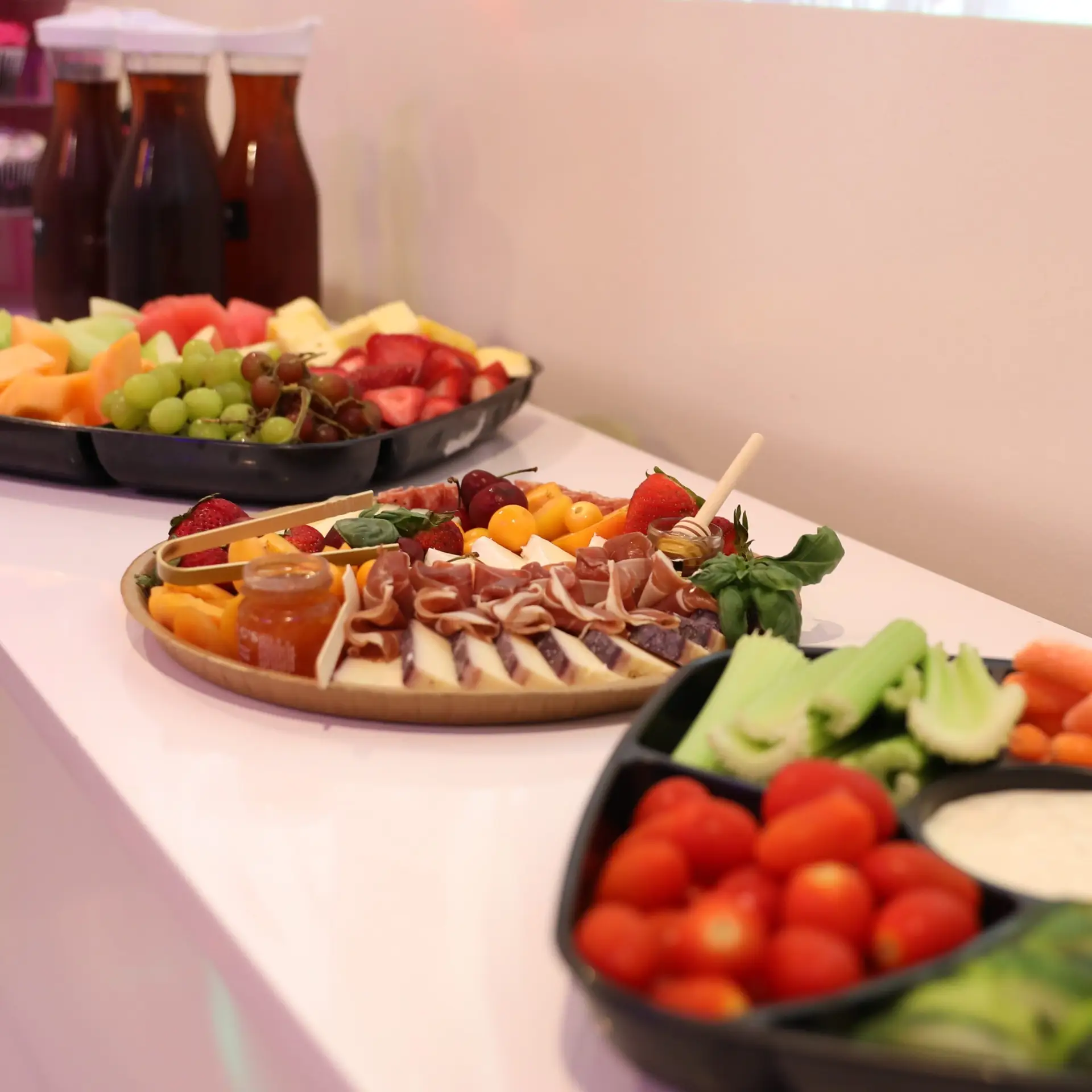 Birthday party catering spread with fruit, charcuterie and veggie platters at Ready Set Fun in Sandy Springs