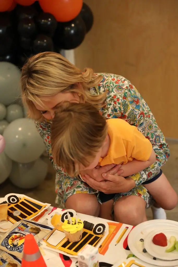 Mom hugging her child at a kids birthday party at Ready Set Fun indoor playground in Sandy Springs