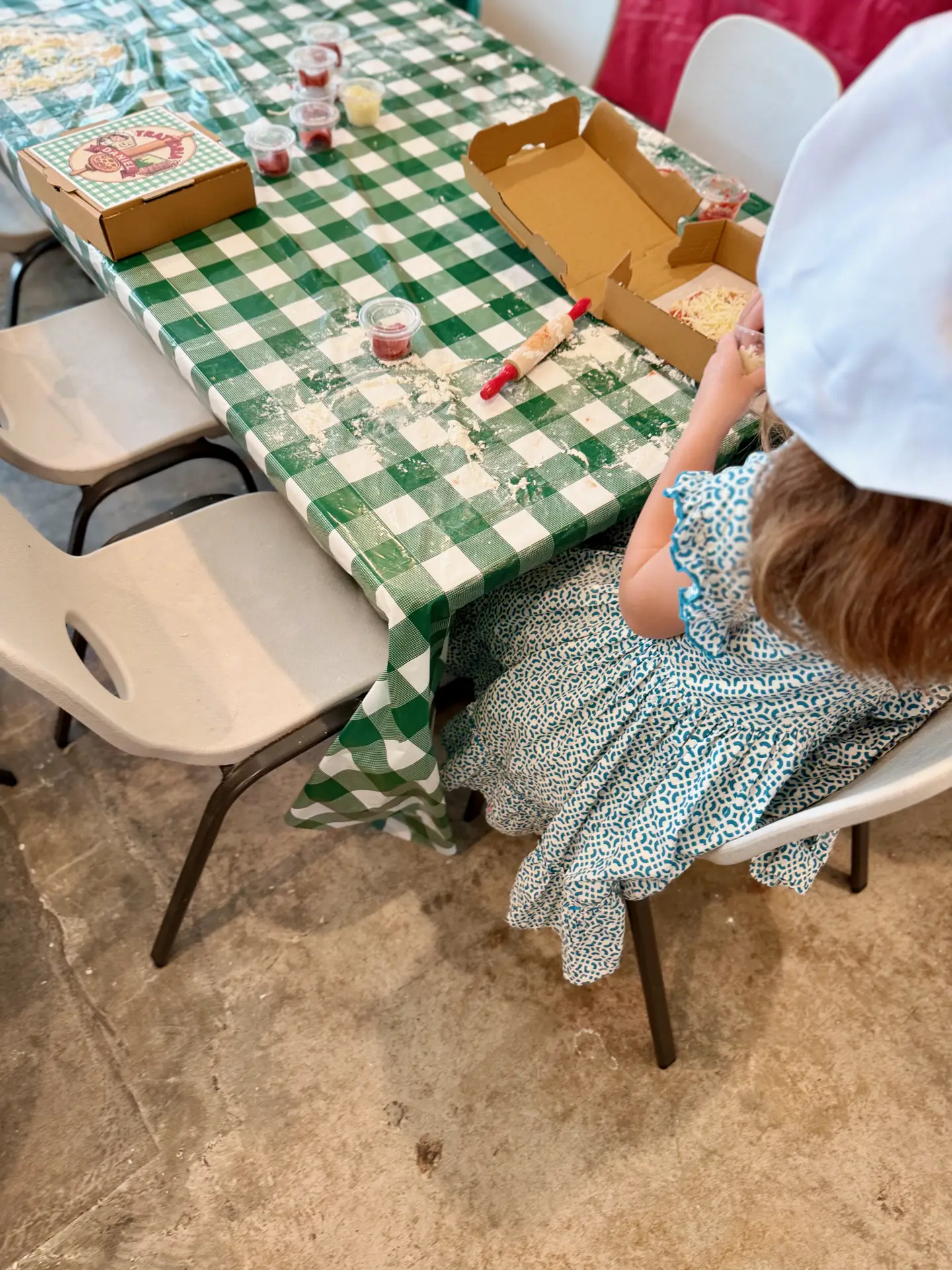 Young child making pizza at kids birthday party at Ready Set Fun in Sandy Springs