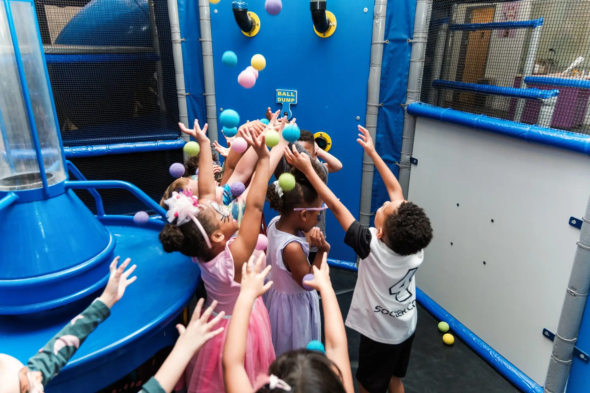 kids catching balls from the ball drop indoor playground ready set fun sandy springs